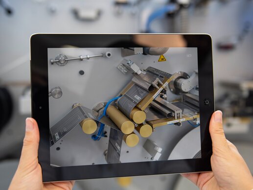 Tablet in front of PackSys Global machine