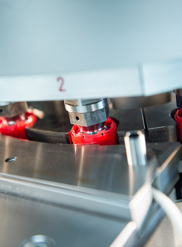 Plastic caps in SDL machine