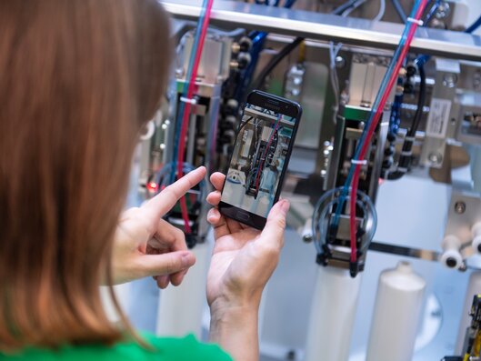Woman scanning machine on the phone