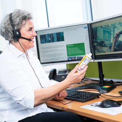 Woman discussing tube on headset