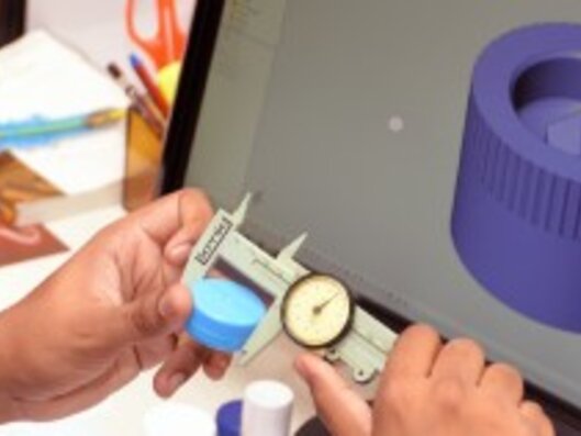 Man measures plastic cap