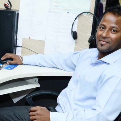 Indina man working on computer