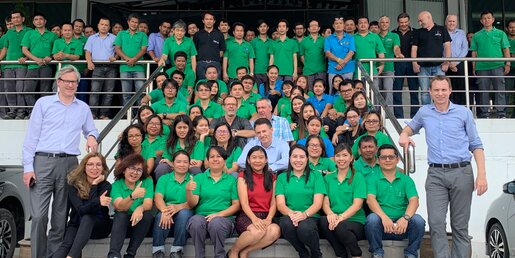 PackSys Global Thailand Team on the stairs