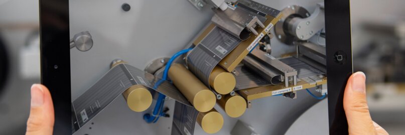 Tablet in front of PackSys Global machine