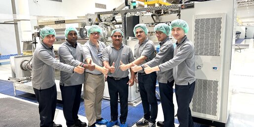 Mr. Monojit Bandyopadhya, (middle), Senior Vice President Operations & Country Head, SRF Industries (Thailand) Ltd. and Mr.Kumpol Nateethanasarn,(3rd from left ) Service Director of Brueckner Group Asia- Pacific posed for a photograph with the SRF team in front of the Inline Coater Unit. 