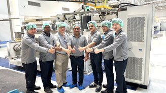 Mr. Monojit Bandyopadhya, (middle), Senior Vice President Operations & Country Head, SRF Industries (Thailand) Ltd. and Mr.Kumpol Nateethanasarn,(3rd from left ) Service Director of Brueckner Group Asia- Pacific posed for a photograph with the SRF team in front of the Inline Coater Unit. 